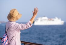 Cruising into the New Year: What’s new in cruises for 2025 rear-view-of-senior-woman-with-hat-looking-at-ferr-2024-11-02-22-48-16-utc
