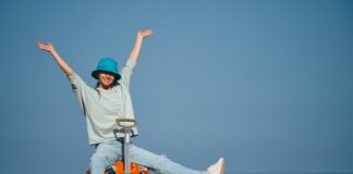 Travelling Against the Crowd: Exploring the Off-Peak Advantage happy traveller ocean suitcase