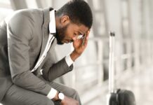 Denied at the U.S. Border? Why Unmanaged Business Travel is a Growing Risk businessman stressed about late transportation