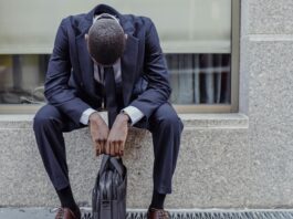 man sitting with briefcase