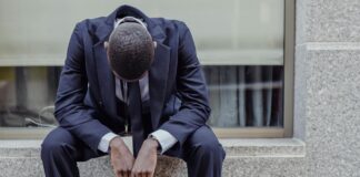 Red-eye flights, presenteeism and retention: Why recovery should be built into every itinerary man sitting with briefcase