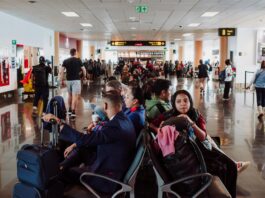 people sitting at boarding gate