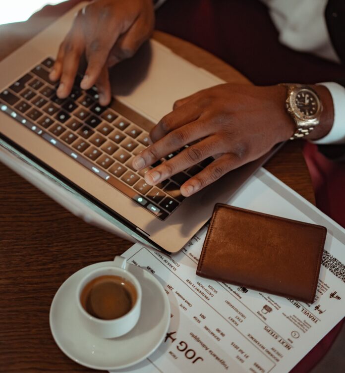 pexels-mikhail-nilov-7821283 (1) Laptop and passport