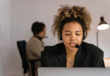 FCM Travel begins global roll-out of AI-powered conversational booking feature Woman talking to computer