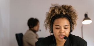 FCM Travel begins global roll-out of AI-powered conversational booking feature Woman talking to computer