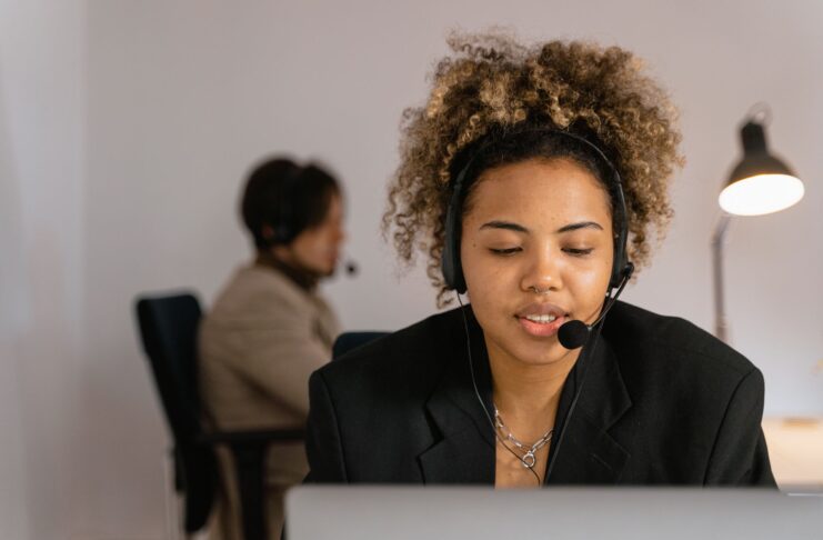 Woman talking to computer